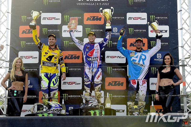 The MXGP podium of Febvre (center), Van Horebeek (left), and Strijbos (right).