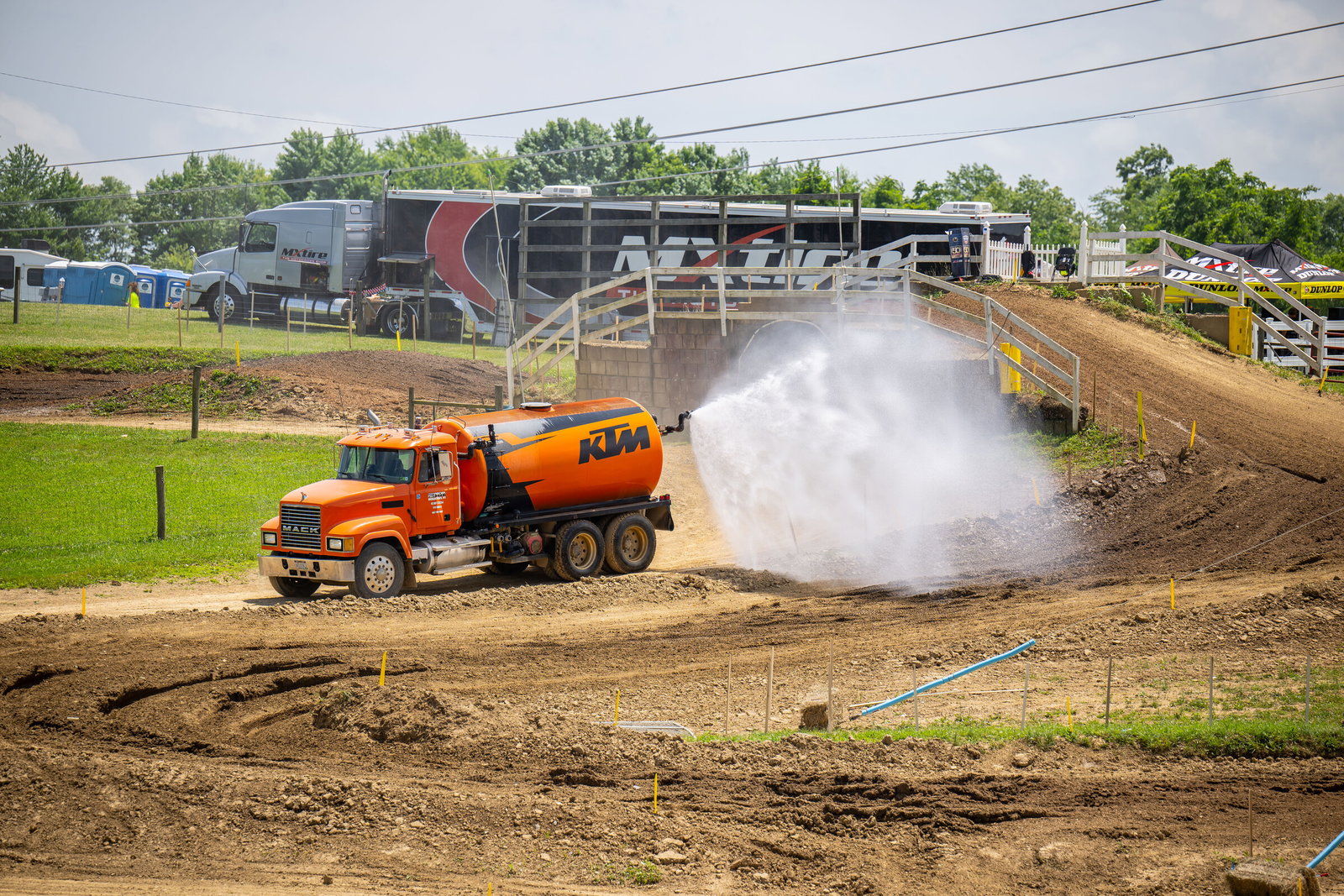 The High Point Raceway gets watered between amateur practice sessions on Friday.