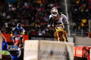 Ryan Dungey (10) chased Jake Moss early in the main.