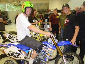 Andy Bell on Josh Grant’s YZ450F getting ready to ride through the shop with Travis. 