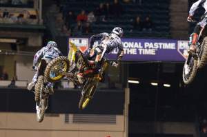 Note the national pastime sign in the background. If we had battles like this every week, supercross would be bigger than baseball.  