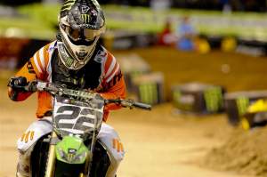 Chad Reed rides off the Phoenix track with his broken left hand at his side.