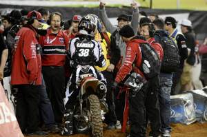 Canard is met by his team(s) and Fox's Chris Onstott (fists in the air) after the main.