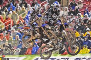 Michael Byrne (26), Justin Brayton (23) and Michael Blose (67) go three-wide off the track's second triple on the first lap. Byrne held third until rear-brake problems dropped him back.