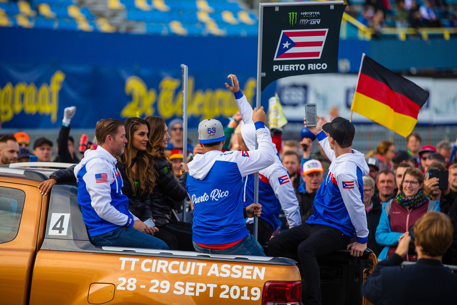 Starling (far right) recording the crowd as Team&nbsp;Puerto Rico made its way through the team introductions on Friday.