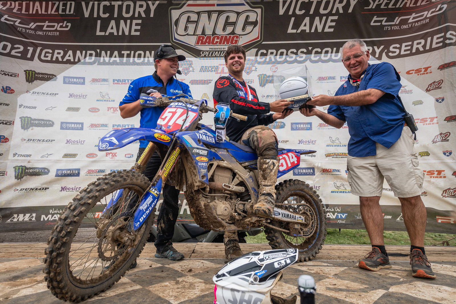 Steward Baylor being awarded the Hoosier GNCC overall trophy from Racer Productions Event Director, Tim Cotter.
