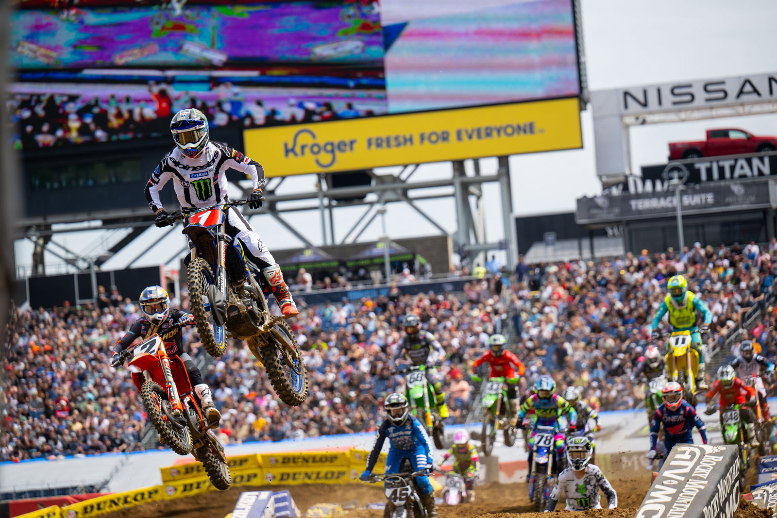 Tomac and Webb ahead of the field at the start of the first 450SX heat race at the Nashville Supercross.