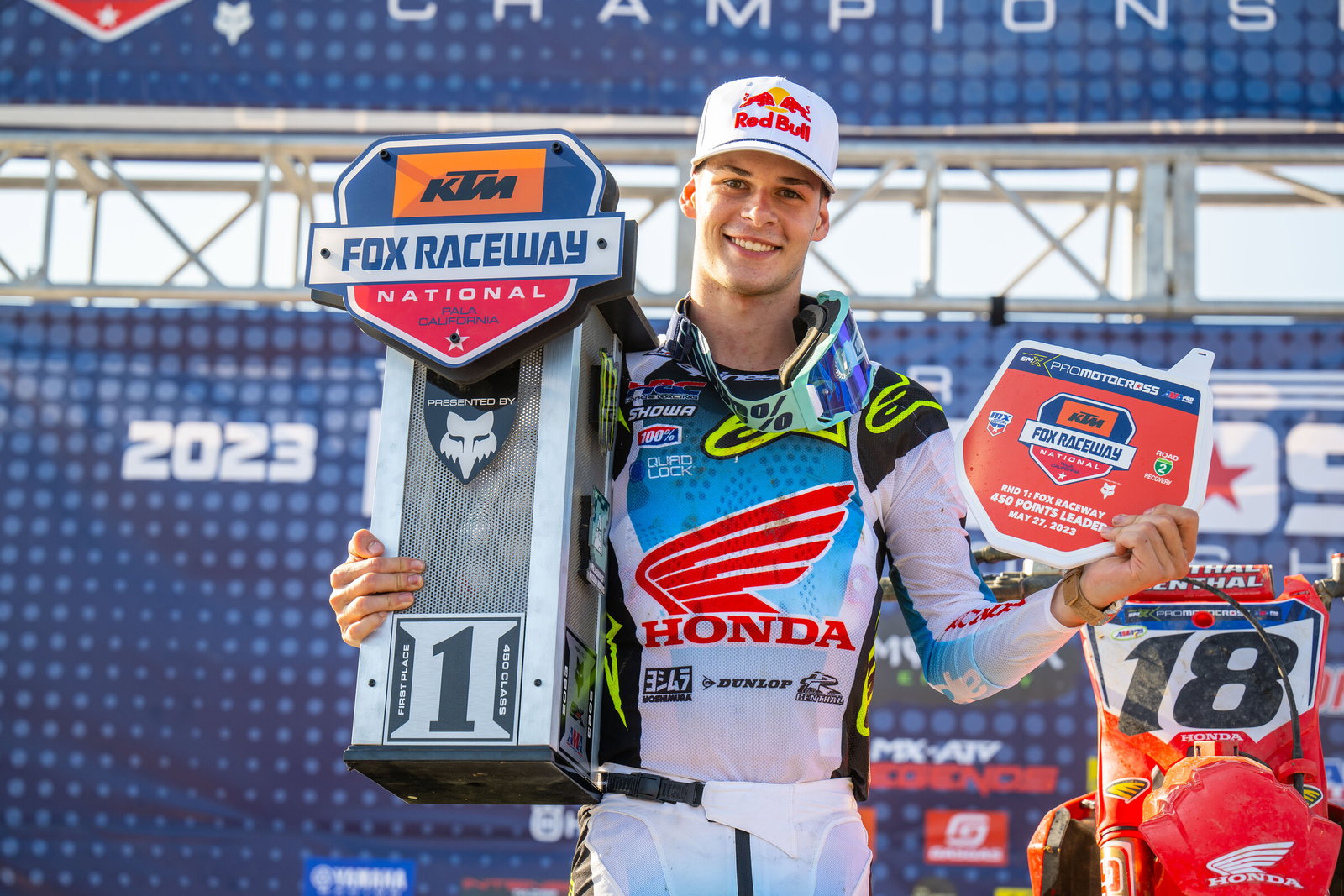 Jett Lawrence with his first place overall trophy&mdash;and the points leader red plate.