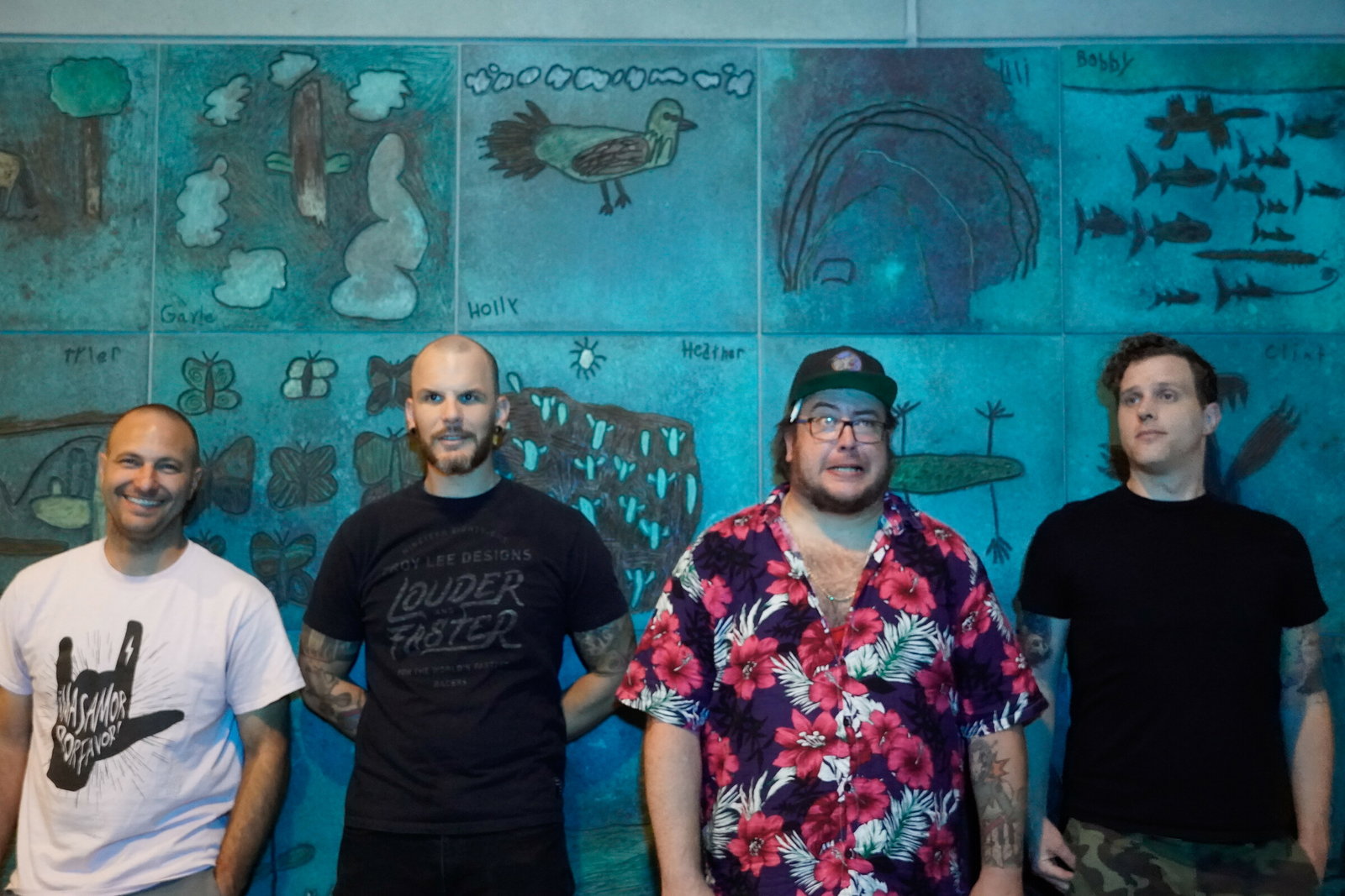 From left to right: Jared Mackay (drums), James Peterson (bass guitar, backing vocals), CJ Coop (lead vocals, guitar), and Grason Roylance (lead guitar, backing vocals),