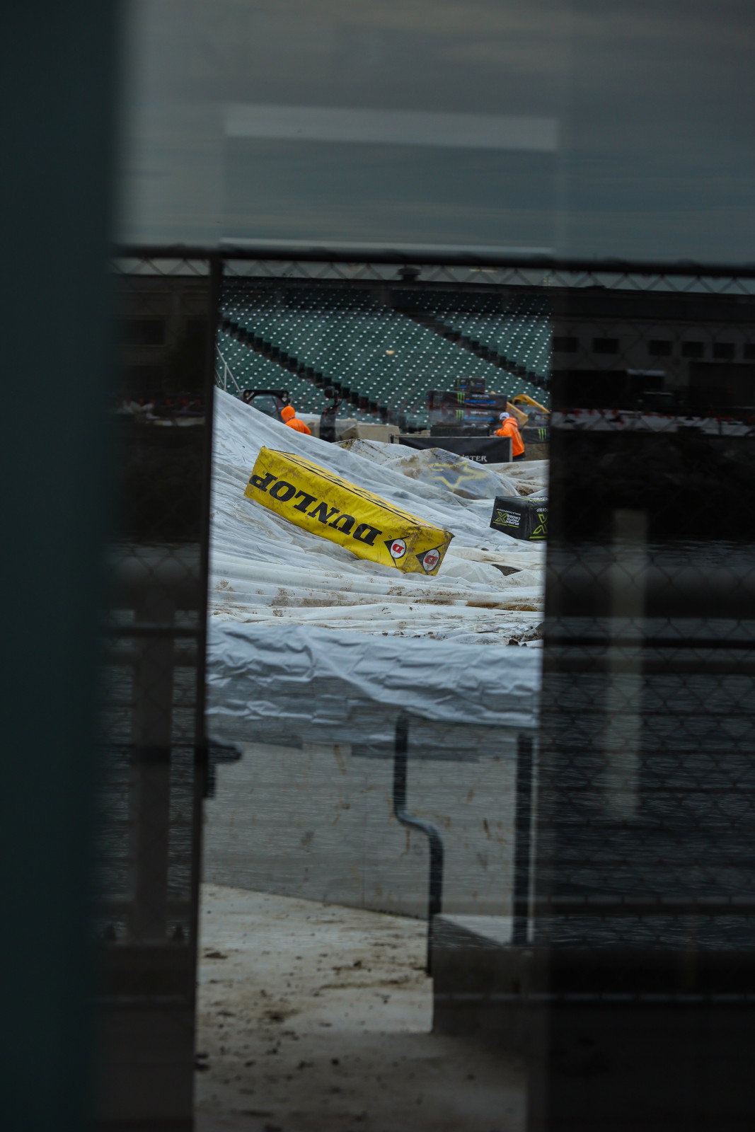 A sneak peak of the stadium from outside of the covered track, via a glass window and an open door.