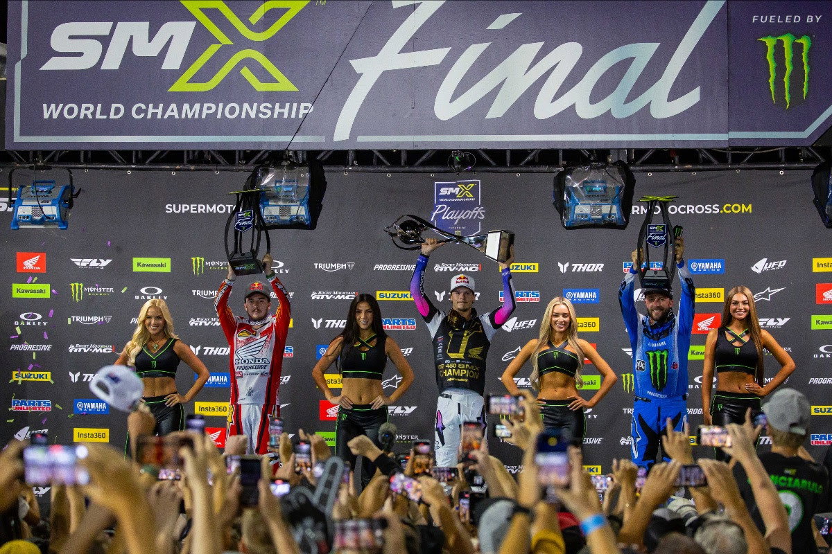 Jett Lawrence raising his third SMX World Championship trophy in Las Vegas last September at the SMX World Championship Final. Hunter Lawrence, pictured to the left came in second.