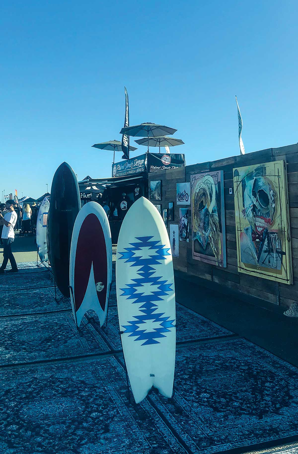 surf boards next to art installations