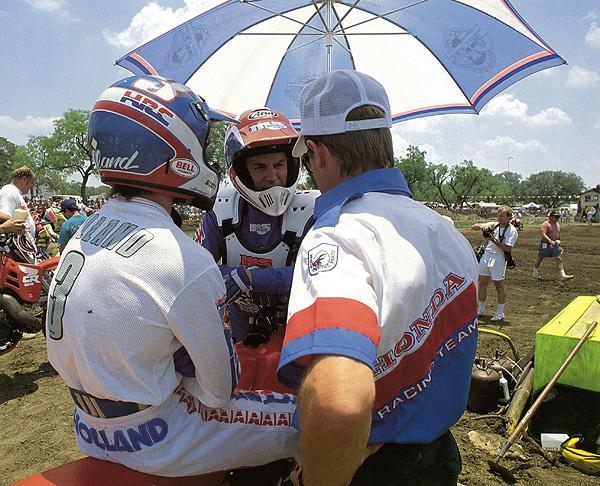 Team Honda riders George Holland and Guy Cooper (center) compare notes before a 125 National.