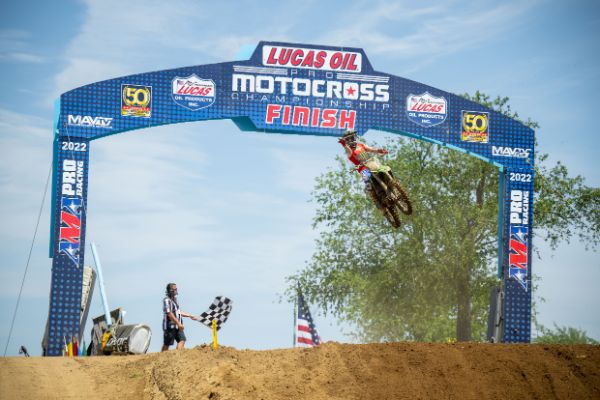 Jo Shimoda takes the checkered flag in the first moto at the RedBud National. Shimoda earned his maiden professional moto win and overall win that day, becoming the first Japanese rider to win in AMA Motocross history.